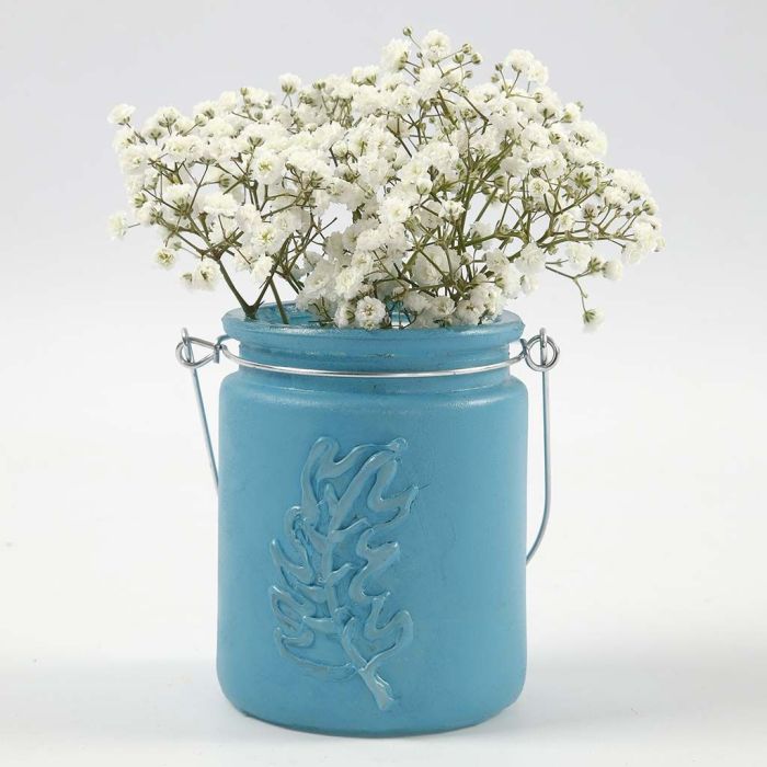 Porta velas pintado con una pluma en relieve