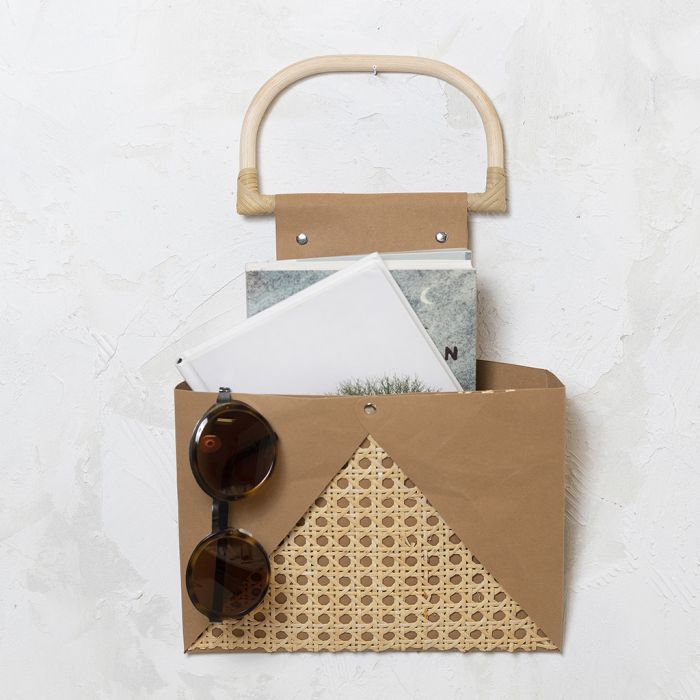 Wall mounted storage from faux leather paper and rattan
