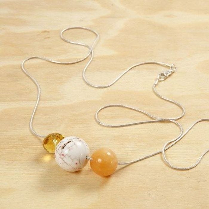 Beads on a long silver-plated Necklace