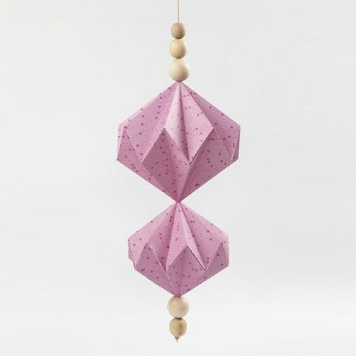 A hanging Decoration with Vivi Gade Design Paper Diamonds