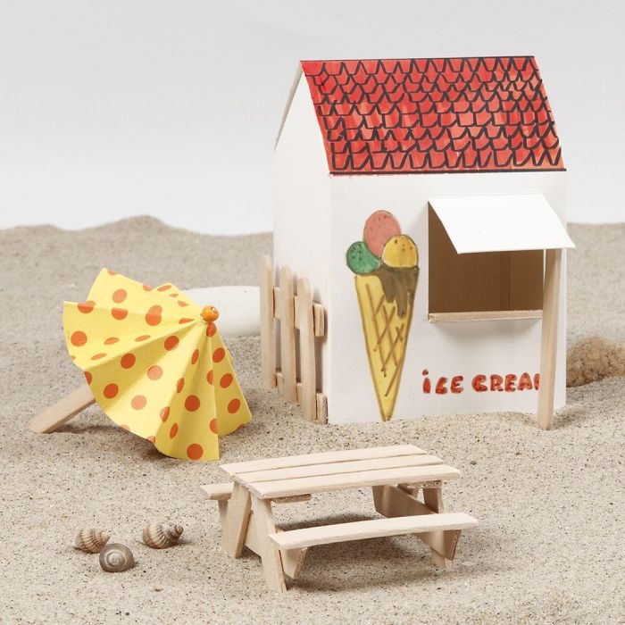 Sombrilla y mesa de picnic hechos con palos de polo