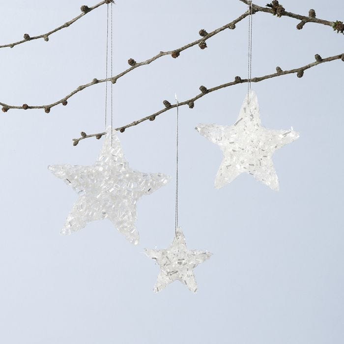 Decoraciones colgantes de estrellas brillantes hechas de Sticky Base y purpurina