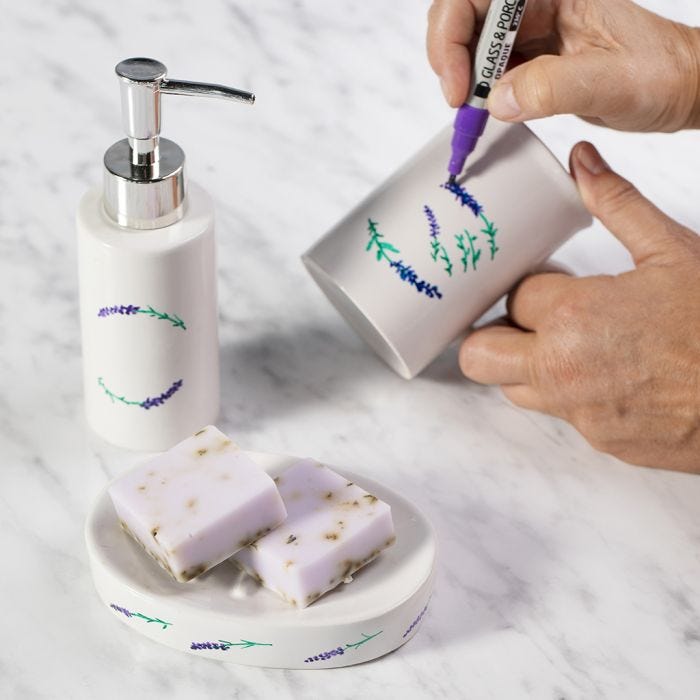 A soap dish and a soap dispenser decorated with porcelain markers