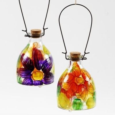 A Glass Wasp Trap decorated with a painted floral Design