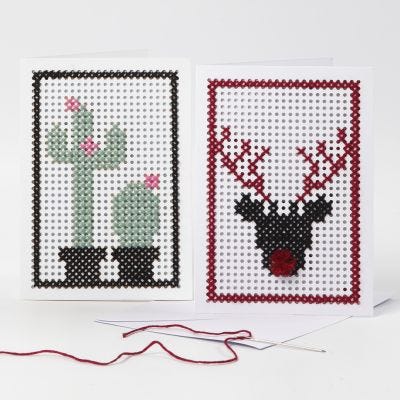 Tarjetas de felicitación bordadas con un cactus y un reno