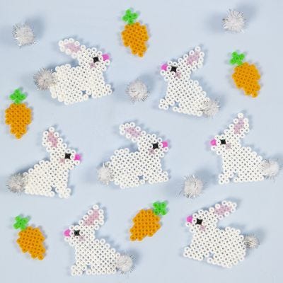 Conejos de Pascua de cuentas Nabbi Fuse con cola de pompon