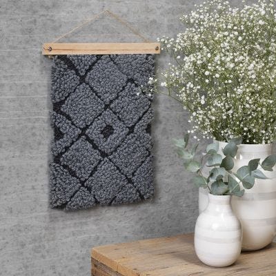 A wall hanging with punch needle embroidery