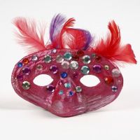 A Papier-Mâché Mask with Feathers and Rhinestones