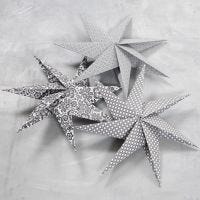 Estrella de siete puntas hecha con trozos de papel cuadrados
