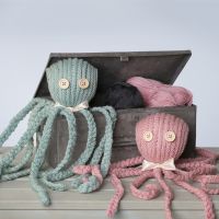 A knitted Octopus with a Satin Ribbon Bow Tie