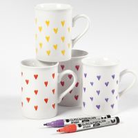 Porcelain mugs decorated with hearts using glass & porcelain markers